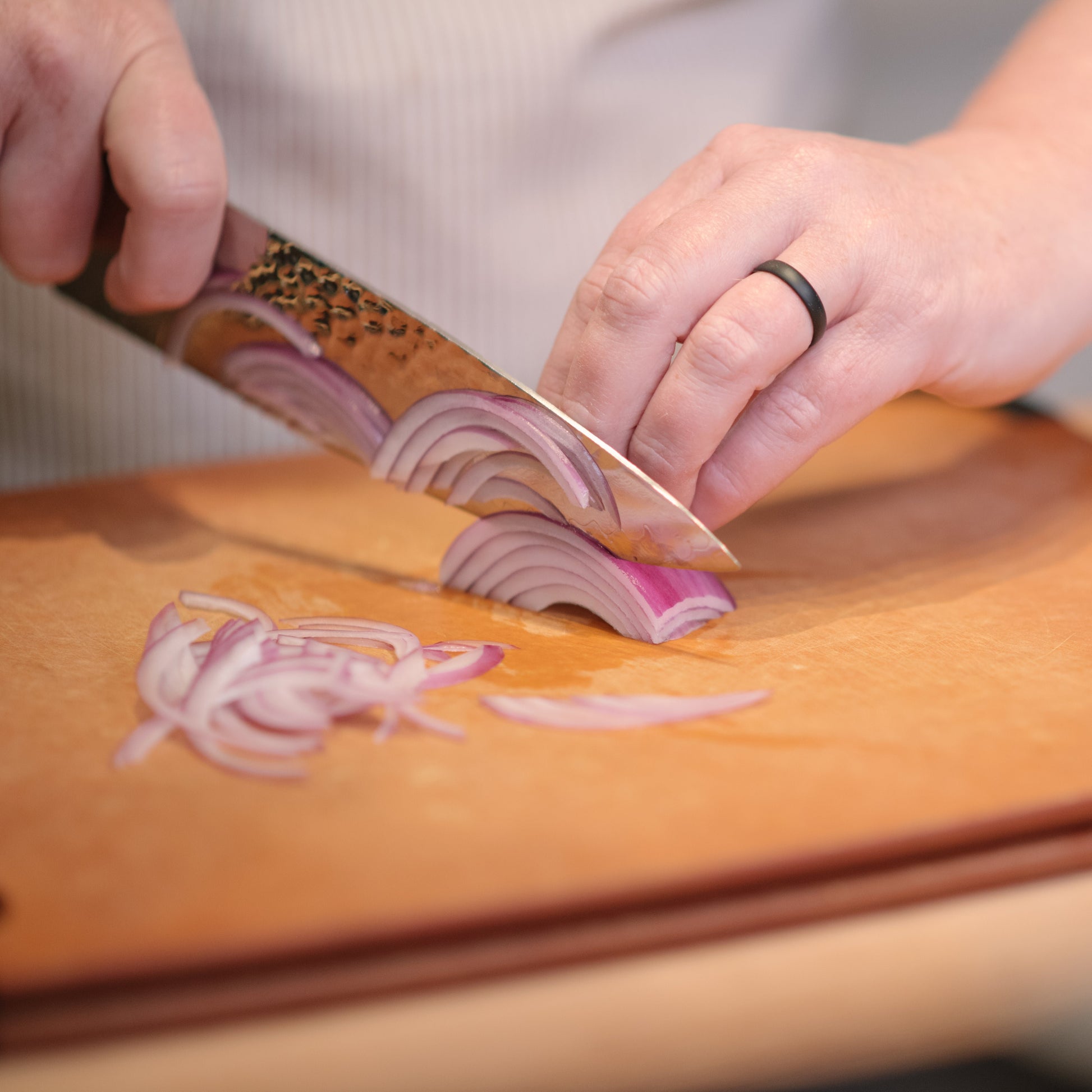 Cutting onions in our knife skills cooking class
