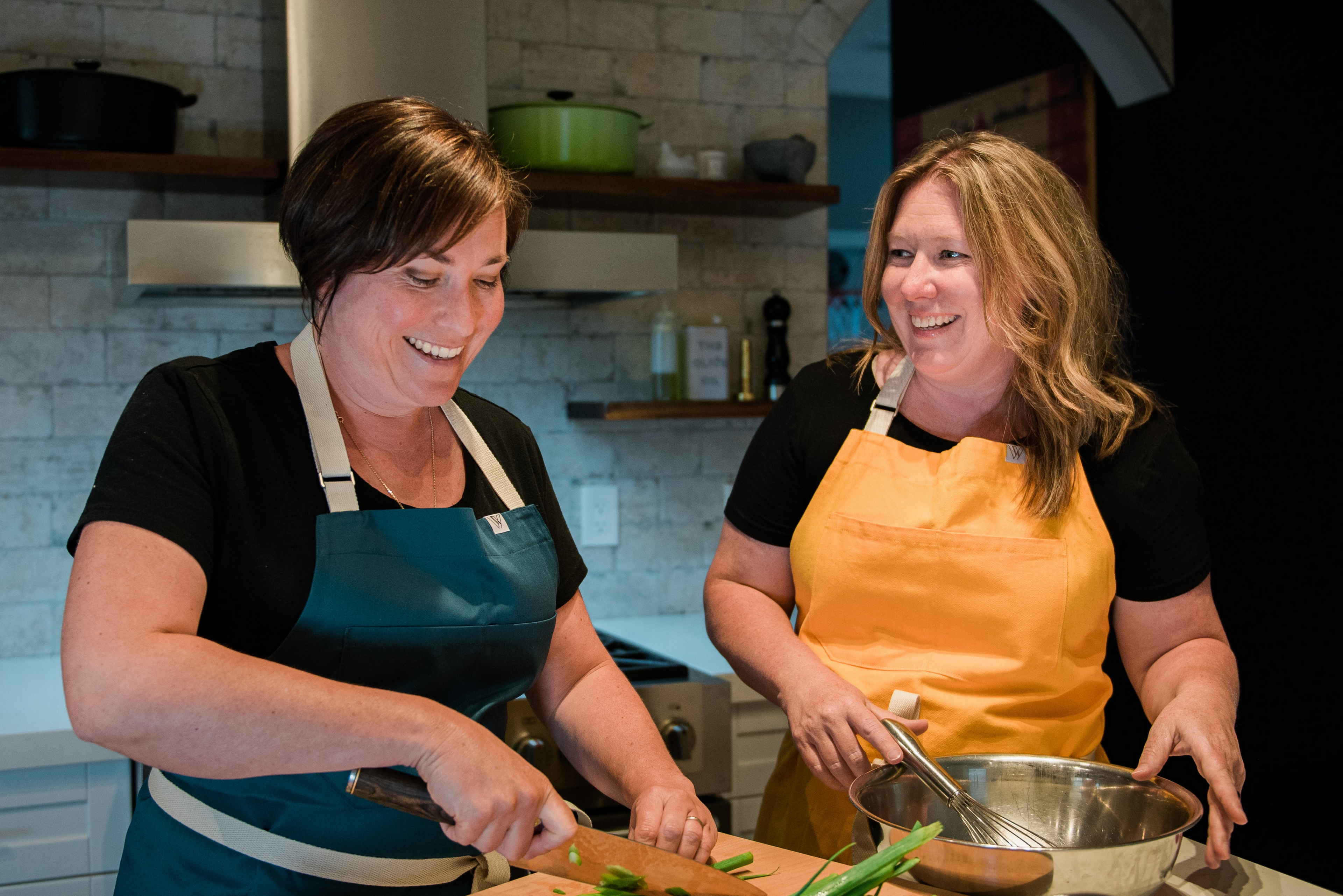 Jody and Kirstie From The Culinary Studio Cooking and Chopping Vegetables