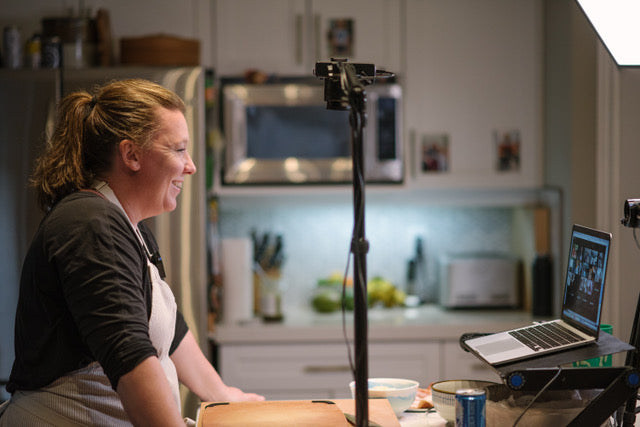 Jody smiling into the camera on a virtual cooking class